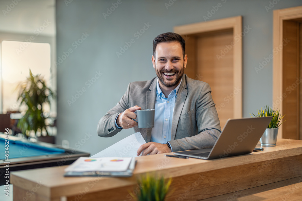 Fototapeta premium Man with laptop computer working at home office