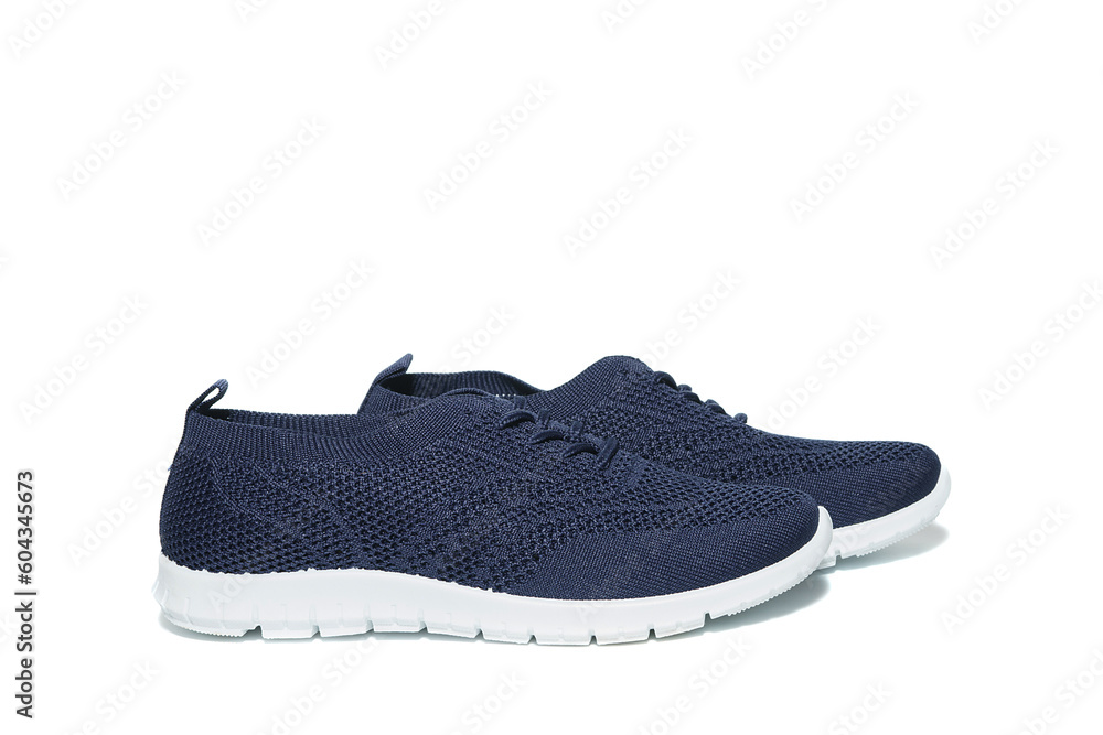 Summer blue casual sneakers made of mesh fabric, on a white background, isolated Summer blue casual sneakers made of mesh fabric, on a white background, isolated
