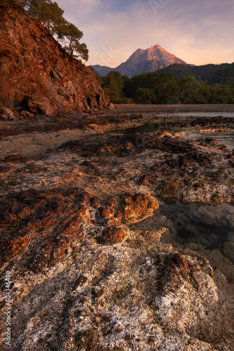 Golden sunrise landscape with rocks, cliff, forest and mountain on Lycian way, Tekirova, Turkey