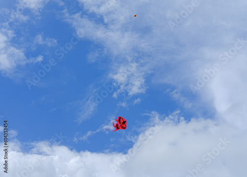 kite in the sky, red kite, cloudy blue sky, red kite in the blue sky