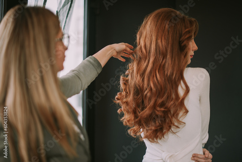 Model with curly hair standing