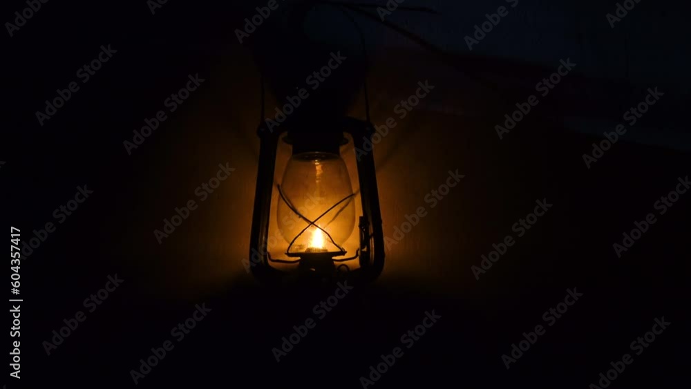 Kerosene lanterns of warm yellow light hang on the walls. Kerosene lanterns of warm yellow light hang on the walls.