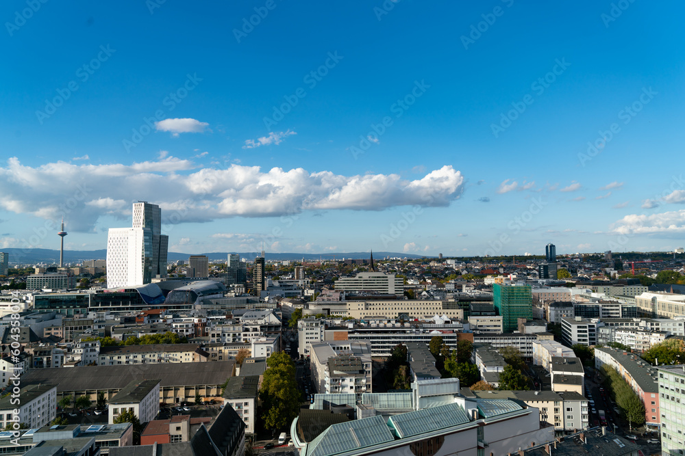 Daytime  video of the Frankfurt skyline, featuring iconic architecture, in autumn with partly cloudy weather. Ideal for background and urban-themed projects.