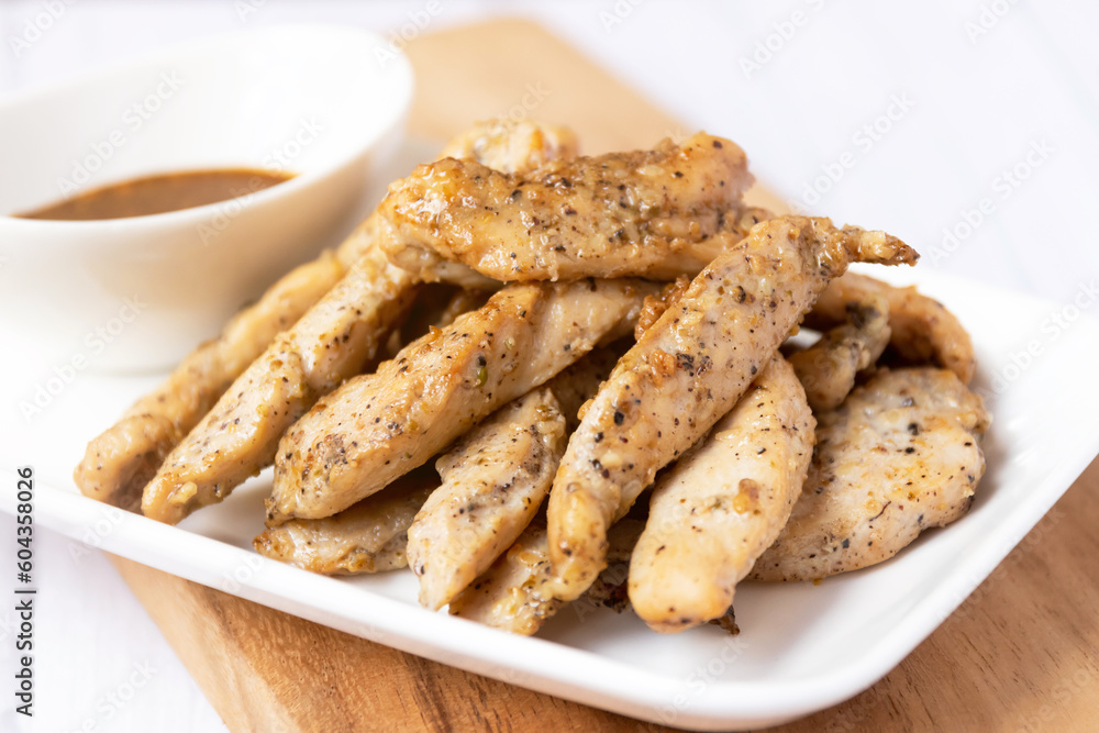 Fried chicken with garlic and pepper with Thai spicy dipping sauce (Jaew sauce). Fried chicken with garlic and pepper with Thai spicy dipping sauce (Jaew sauce).