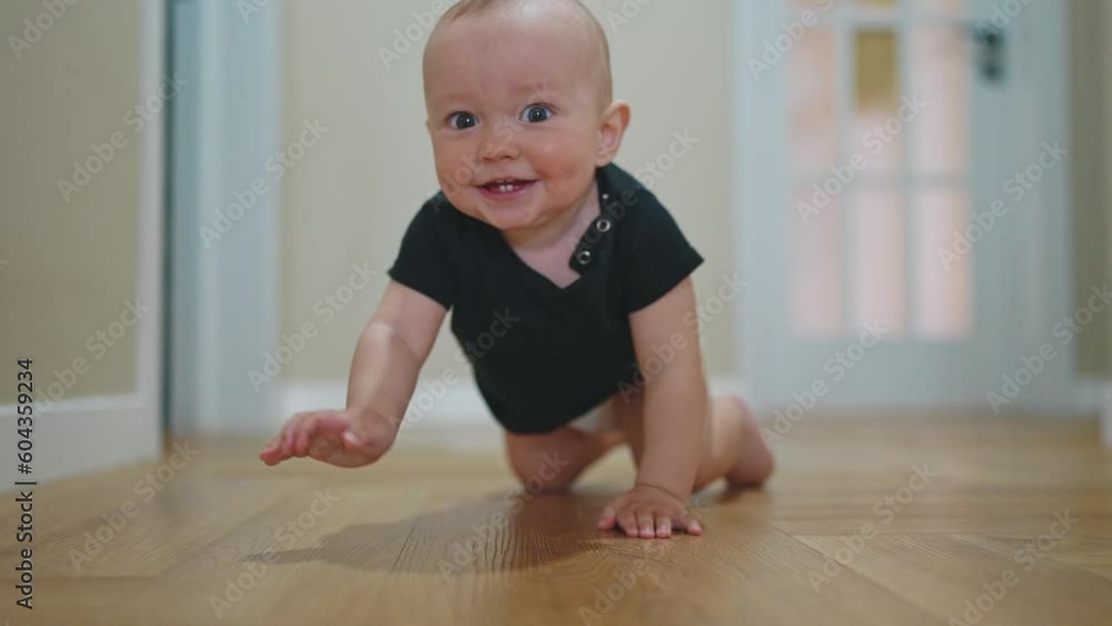 baby son crawling. happy family a first steps kid dream concept. baby newborn crawling down the hallway in the house. happy baby boy lifestyle crawling on the floor takes her first steps baby son crawling. happy family a first steps kid dream concept. baby newborn crawling down the hallway in the house. happy baby boy lifestyle crawling on the floor takes her first steps
