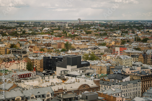 Aerial view of a residential district in an ancient city, filled with bustling crowds and awe-inspiring architecture of Riga