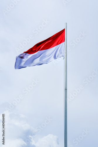 flag of Indonesia, flag of the country, waving flag, red and white flag, waving flag against a clear sky background