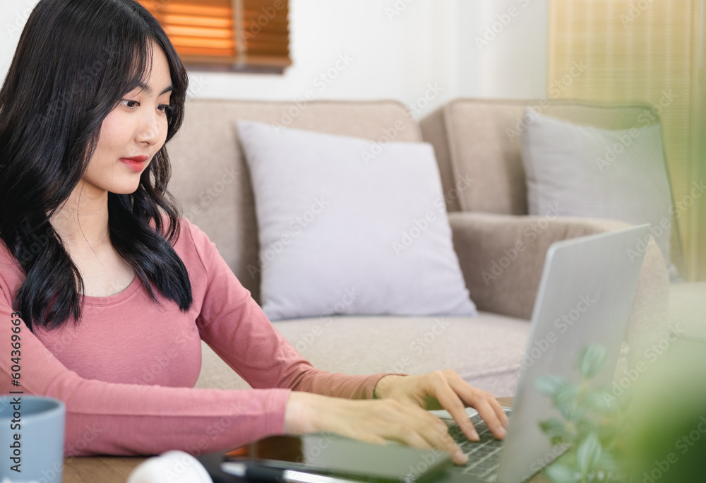 Attractive businesswoman studying online, using laptop software, web surfing information or shopping in internet store.Head shot pleasant happy young woman freelancer working on computer at home. Attractive businesswoman studying online, using laptop software, web surfing information or shopping in internet store.Head shot pleasant happy young woman freelancer working on computer at home.