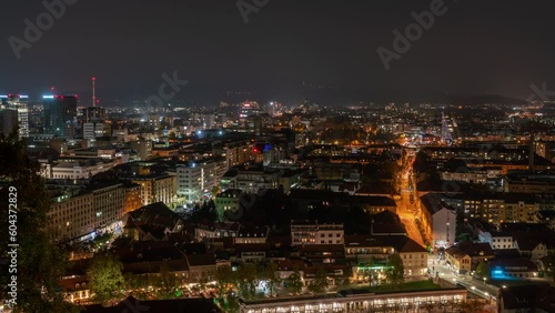 Wallpaper Mural Timelapse footage capturing the autumn skyline of Ljubljana, Slovenia at dusk. Clouds swiftly move over the urban landscape, featuring numerous buildings and trees. Torontodigital.ca