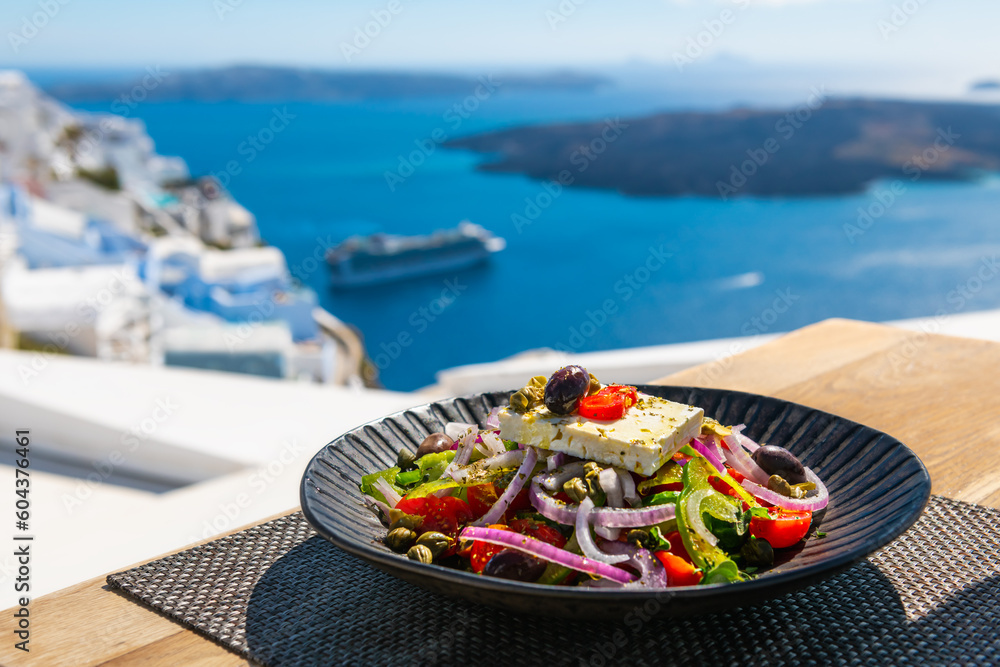 Greek salad with beautiful sea view in Santorini island, Greece.