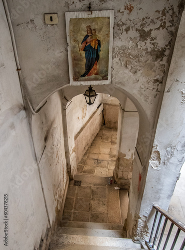 Bari, Italy - one of the pearls of Puglia region, Old Town Bari displays a peculiar architecture with its narrow buildings and its religious icons placed in the inner yards  photo