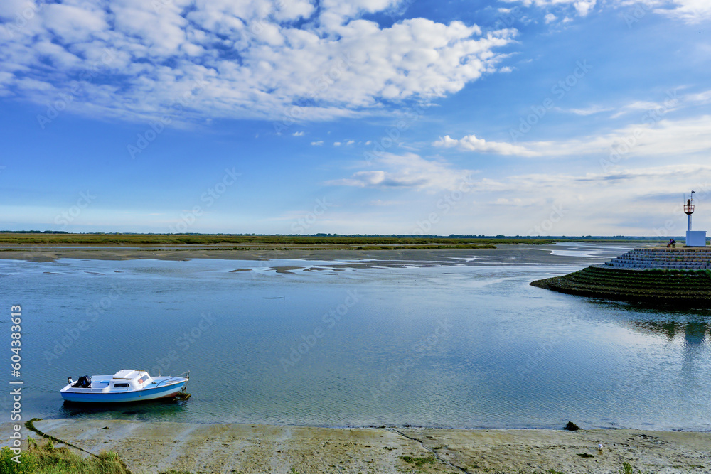 channel of entrance to the port at low tide of Saint Valery sur Somme in the Hauts-de-France departement, France channel of entrance to the port at low tide of Saint Valery sur Somme in the Hauts-de-France departement, France
