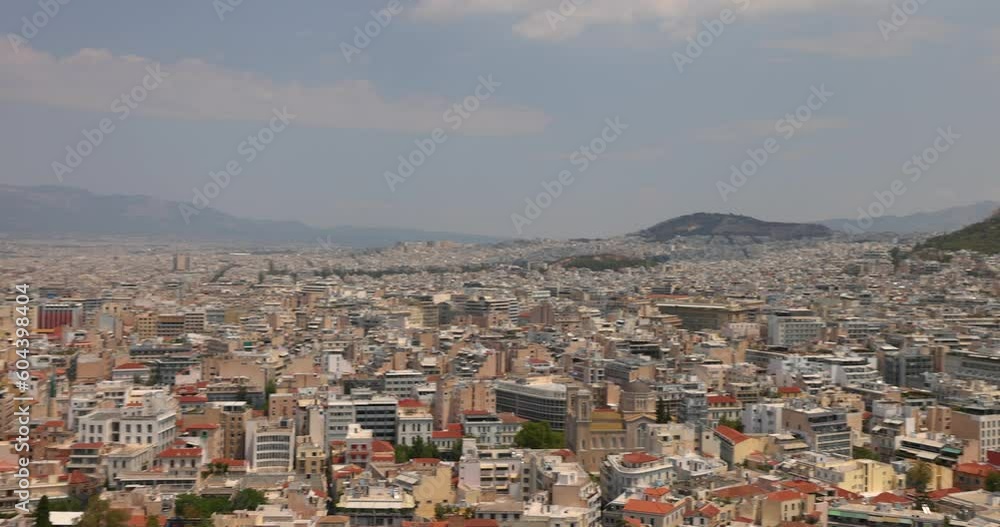 Tourists enjoy the views from the Parthenon on the Athenian Acropolis in the Greek capital city. Tourists enjoy the views from the Parthenon on the Athenian Acropolis in the Greek capital city.