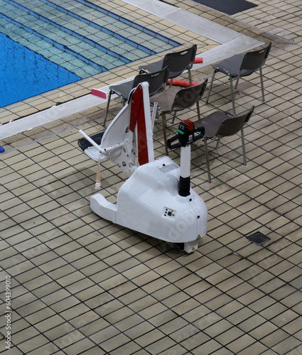 Fotografie Μobile seated chair lift that allows effortless entry into a swimming pool for d