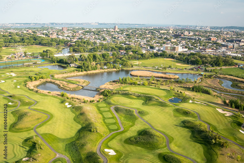 Golf club aerial photo in sunny afternoon, with a lake