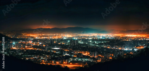night view of a city with many lights and a city of buildings