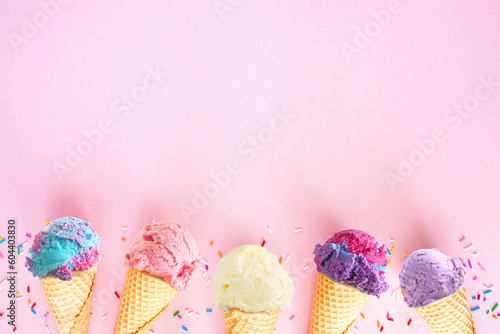 Ice cream bottom border over a pink background. Soft, pastel colors. Copy space.