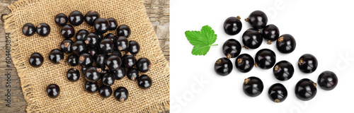 Black currants on burlap and wooden background.Top view. Flat lay pattern