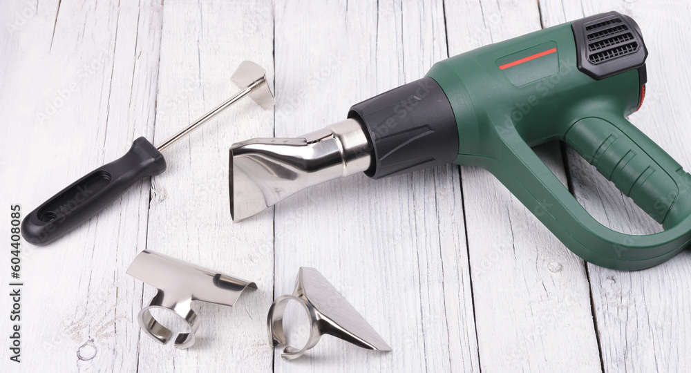 Construction hair dryer with different nozzles for work. Construction hair dryer with different nozzles for work.