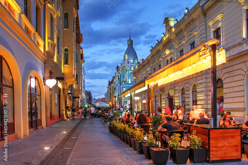 Pedestrian street at night in Oradea, Romania photo