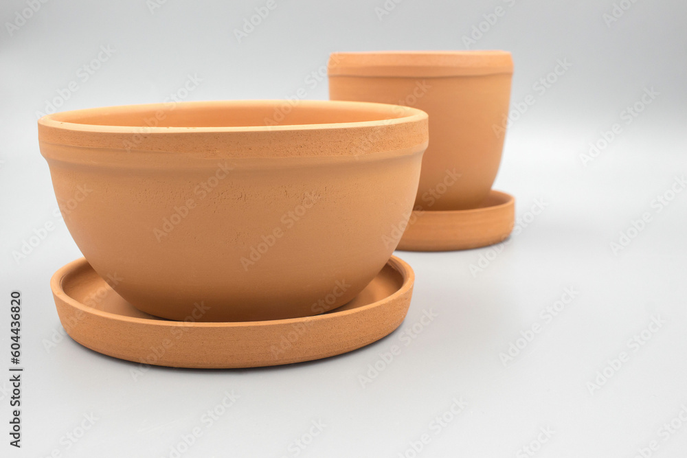 Empty clay flower pots isolated on a white background Empty clay flower pots isolated on a white background