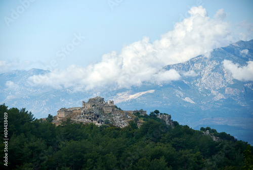 Wallpaper Mural A breathtaking view of Tlos, Turkey: ancient ruins surrounded by lush forest and majestic mountains in the clouds. Torontodigital.ca