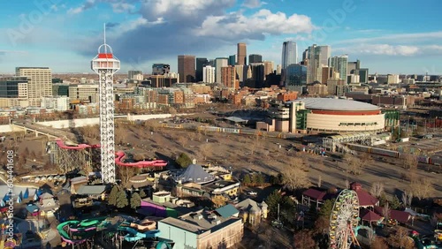 2023 - Excellent aerial footage moving from Elitch Gardens amusement park towards skyscrapers in Denver, Colorado. photo