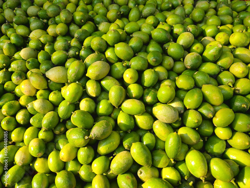 green peas background. The high vitamin C content in lemons helps strengthen the immune system. It promotes the production of white blood cells, which are crucial for fighting off infections and disea photo