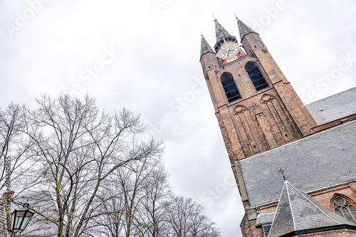 Delft, Netherlands - March 31, 2023:  The tower of the Old Church of Delft in the Netherlands
 photo