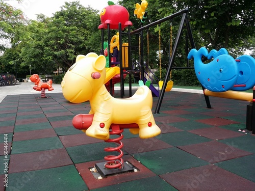 plastic giraffe spring toy playground in the park