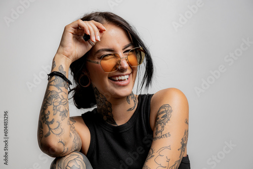 portrat of a Gen Z tattoo girl laughing photo