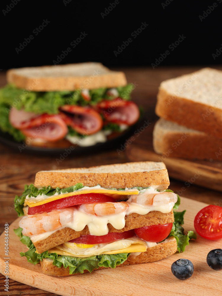 Toast bread sandwich with bacon and vegetables and wheat, indoor shot Toast bread sandwich with bacon and vegetables and wheat, indoor shot