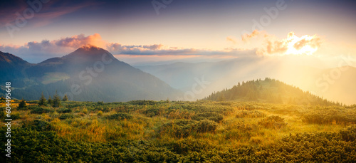 A breathtaking view of the mountain ranges lit by the sun. Carpathian mountains, Ukraine, Europe.