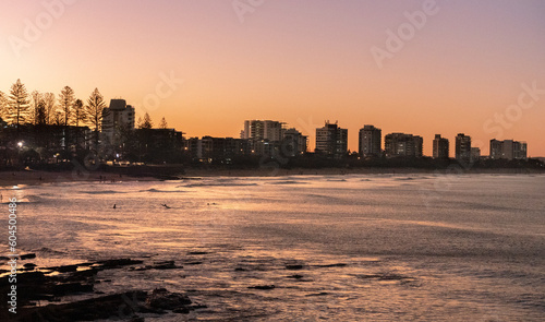 sunset over the city and ocean © Sergei