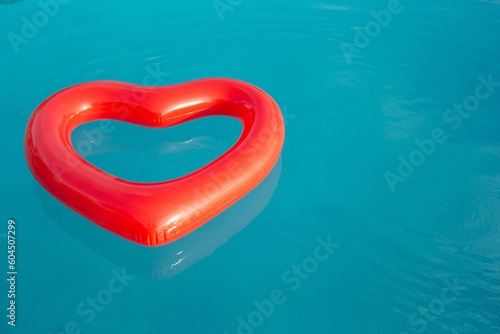 Obraz na plátně Heart Pool floats in resort pool