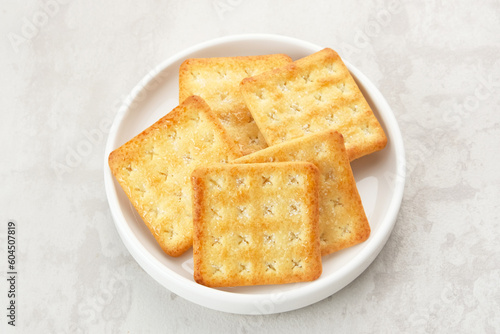 Sugar coated biscuits, also known as malkist, sweet and crispy. Served on white plate
