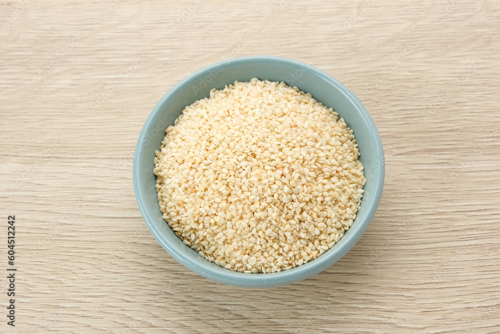 Organic White Sesame Seeds (Sesamum indicum) or Wijen, served in small bowl on wooden background
Organic White Sesame Seeds (Sesamum indicum) or Wijen, served in small bowl on wooden background
