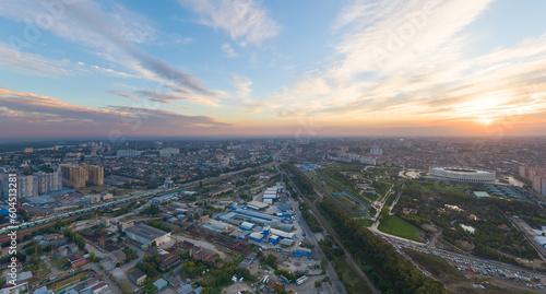 Krasnodar, Russia. Panorama of the city in summer. Park in the city of Krasnodar. Football grounds. Sunset. Aerial view © nikitamaykov