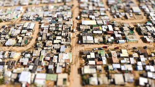 Rural, community and buildings with informal settlement from top view for neighborhood, poverty and development. Society, infrastructure and poor with drone view of township for population location