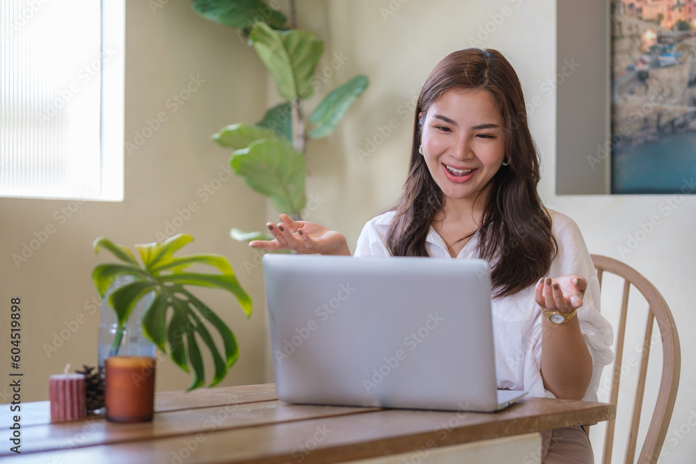 Pretty young woman using laptop for distant studying, online communication at cozy home interior. Pretty young woman using laptop for distant studying, online communication at cozy home interior.