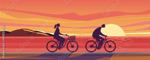 Two happy families riding on bicycles on the beach and and enjoy the sunset scenery