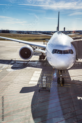 Levi BodoModern airport at sunset. Passenger plane before takeoff. Aerial aviation background concept. Airport airfield with runway background. Ready for summer vacation, travel business photo