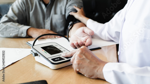 Doctor checking patient arterial blood pressure. Health care