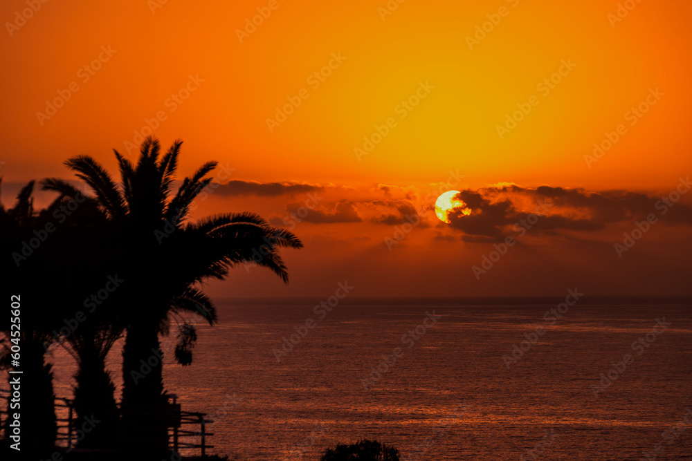 Scenic view of beautiful sunset above the ocean golden sunset beach resort