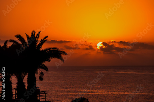 Scenic view of beautiful sunset above the ocean golden sunset beach resort