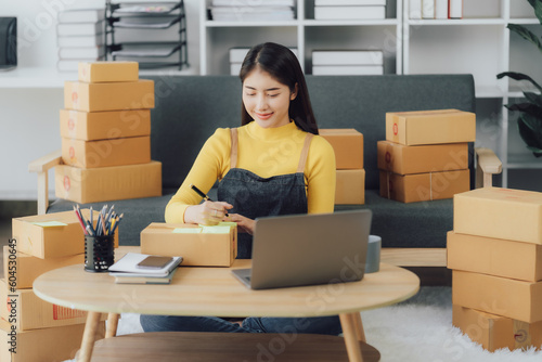 Asian woman enjoy listening to music and drinking coffee and laptop computer in the morning © Kritdanai