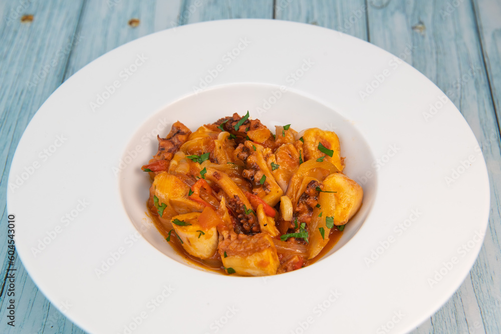 Recipe for octopus Provencal style, tomato, onion, garlic, red pepper, parsley, High quality photo Recipe for octopus Provencal style, tomato, onion, garlic, red pepper, parsley, High quality photo