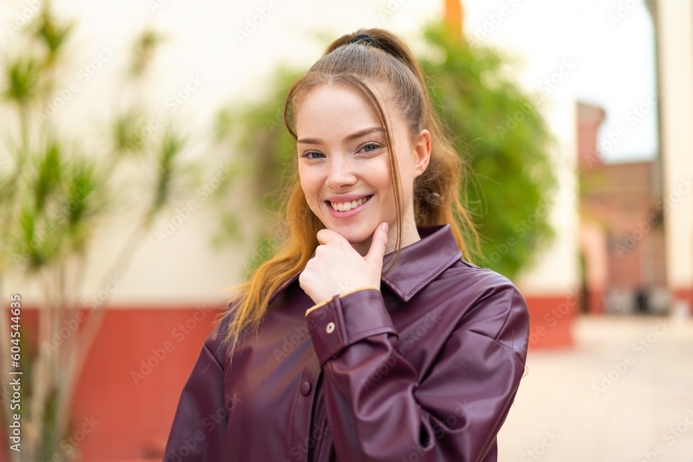 Young pretty girl at outdoors With happy expression