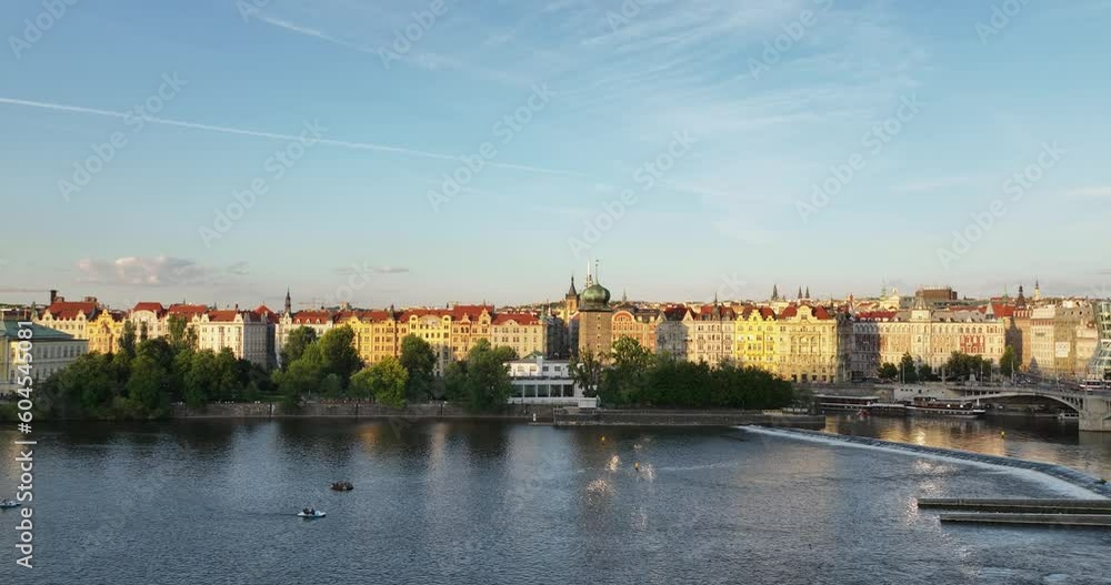 Aerial view of Charles Bridge and Prague Castle in Prague, Czech Republic. Aerial fly of Prague. Aerial view of the red tiled roofs of houses and the Vltava river. Historical building, downtown. Aerial view of Charles Bridge and Prague Castle in Prague, Czech Republic. Aerial fly of Prague. Aerial view of the red tiled roofs of houses and the Vltava river. Historical building, downtown.