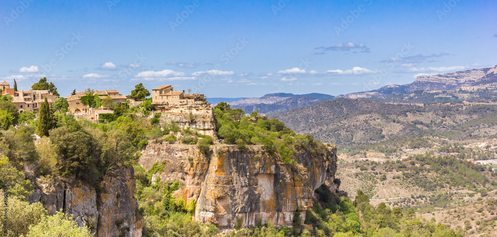 Panorama of historic buildings on the cliffs of mountain village Siurana, Spain